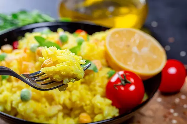 Close up of rice porridge on a fork