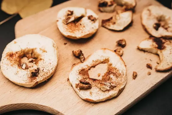 Close up of roasted apples with walnuts, honey and cinnamon