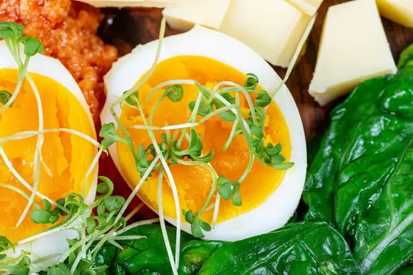 Close- up of sliced boiled eggs with vegetables for Breakfast (Flip 2020)