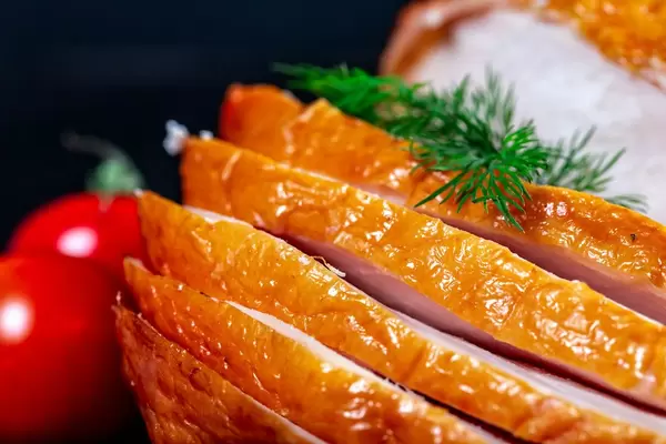 Close-up of sliced smoked chicken on dark background (Flip 2019)