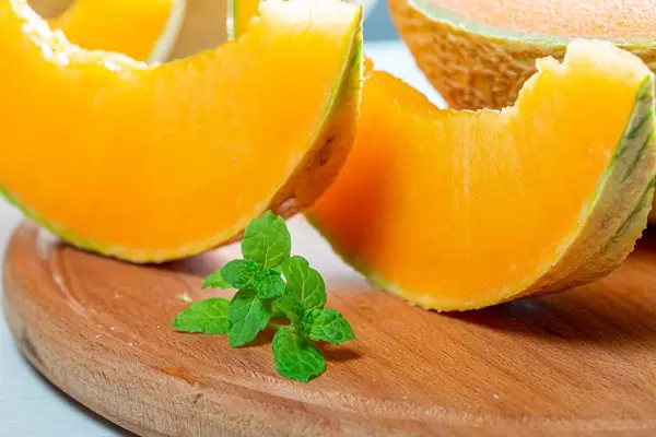 Close-up of slices of fresh melon on the kitchen Board (Flip 2019)