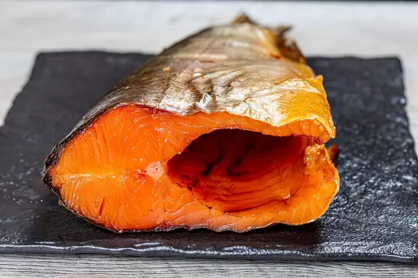 Close up of smoked salmon on a black stone tray (Flip 2019)