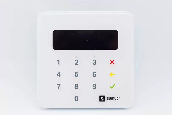 Close-up of SumUp Air card reader for contactless and chip payments against white background