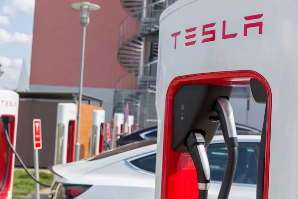 Close-up of Tesla Supercharger station and charging electric cars in Wilnsdorf, Germany