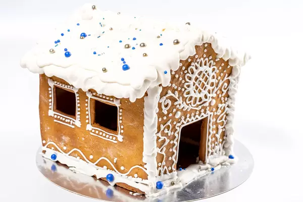 Close-up of the gingerbread house on white