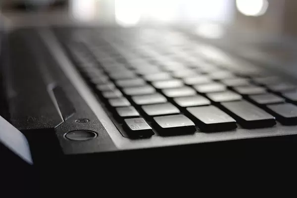 Close-up of the On / Off Button and Laptop keyboard