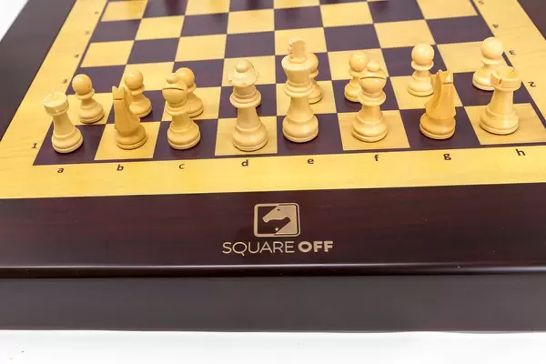 Close-up of the white chess pieces of Square Off, the world's smartest chessboard and e-sport