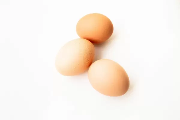 Close up of three eggs isolated on white background  Flip 2019