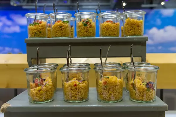 Close-up of vegan couscous salad with tomato, red onion and corn at the BarCamp in Bonn