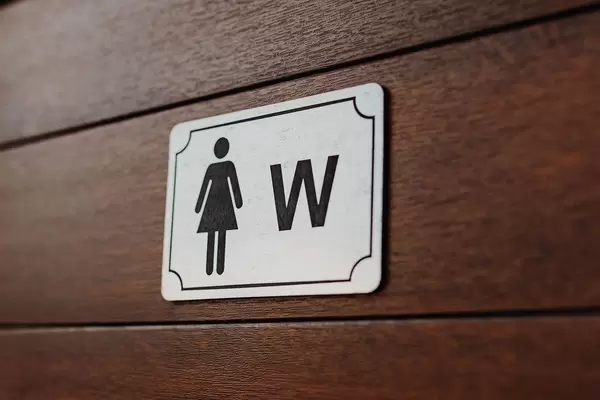 Close up of women bathroom sign