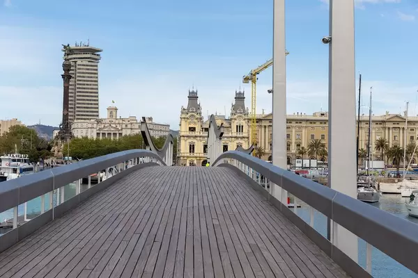 Close-up of wooden bridge and sight Rambla de Mar which connects Portal de la Pau and Moll d'Espanya in Barcelona (Spain)