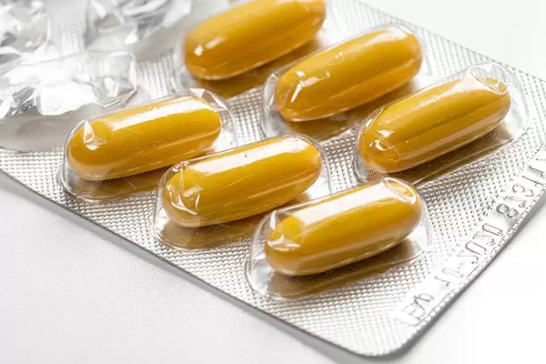 Close - up of yellow capsules in blister (Flip 2019)