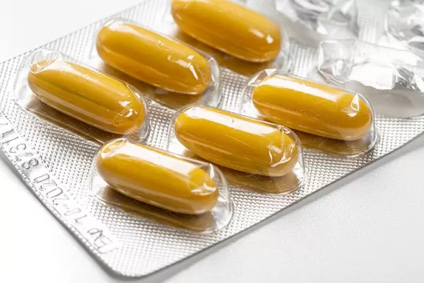 Close - up of yellow capsules in blister