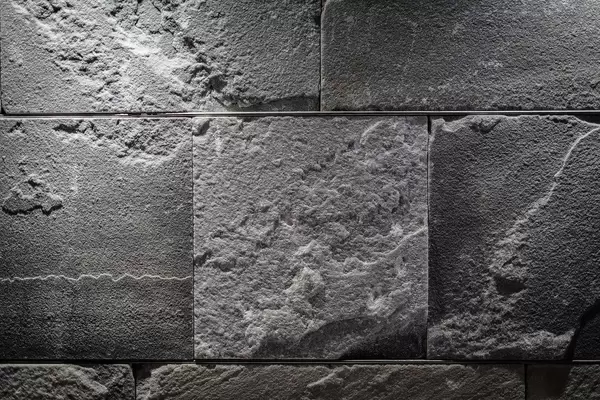 Close Up on a Illuminated  Gray Stone Wall