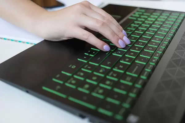 Close Up on Woman's Hand on the Laptop