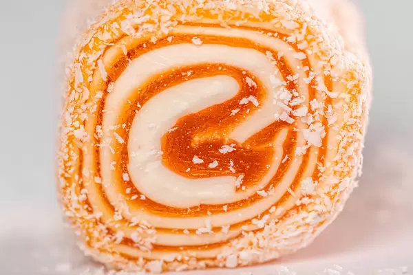 Close-up, orange delight soft candy with coconut flakes