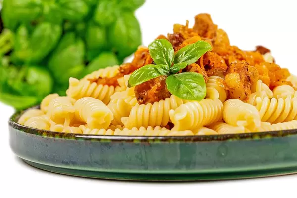 Close-up, pasta with gravy and basil