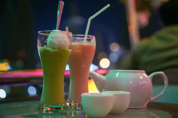 Close Up Photo of Avocado Ice Cream with Coconut, Strawberry Smoothie and a Pot of Tea