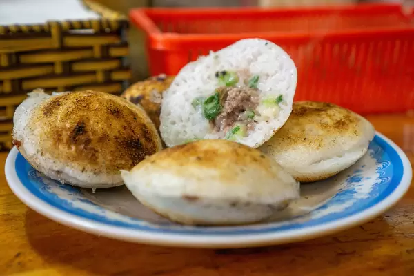 Close Up Photo of Banh Can - Vietnamese Rice Cakes with Quail Egg and Minced Pork