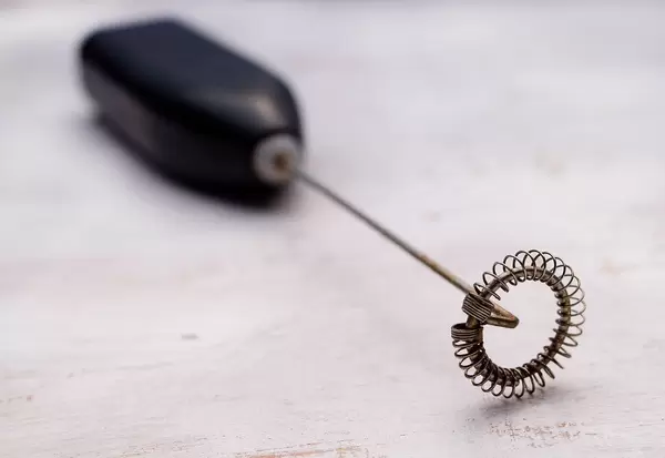 Close Up Photo of Coffee Drink Mixer Milk Frother on White Wooden Table