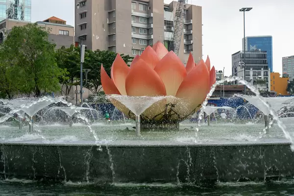 Close Up Photo of Giant Pink Lotus Flower with Water Fountain at Nguyen Hue Walking Street in Saigon, Vietnam