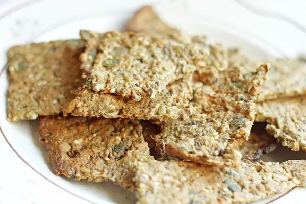 Close Up Photo of Homemade Crackers on a white Plate
