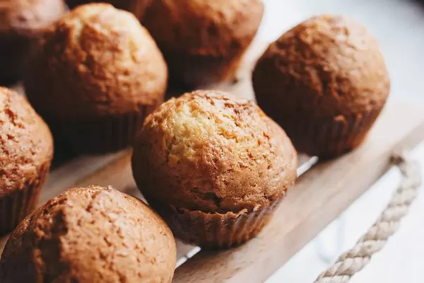 Close Up Photo of homemade Muffins on a wooden Tray