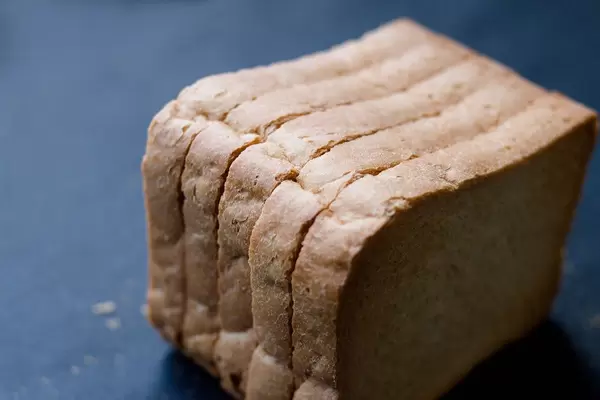 Close Up Photo of Slices of Zwieback on Dark Background