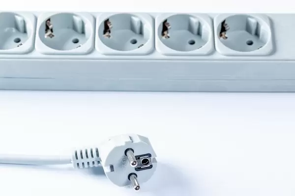 Close Up Photo of White Power Extension on White Background