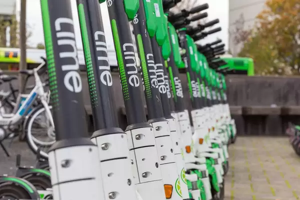 Close-up photo with the brand name: the popular electric scooters operated by Lime provide the citizens of Cologne with a smart urban mobility solution