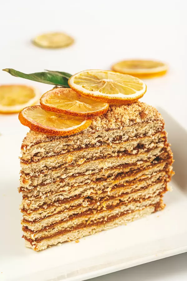 Close-up, piece of honey cake with condensed milk