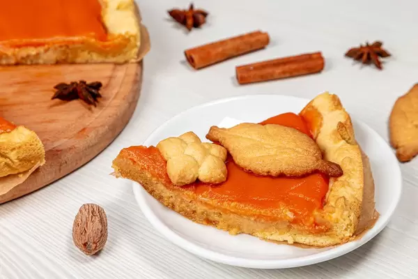 Close-up piece of pumpkin pie with cinnamon, anise stars and nutmeg (Flip 2019)