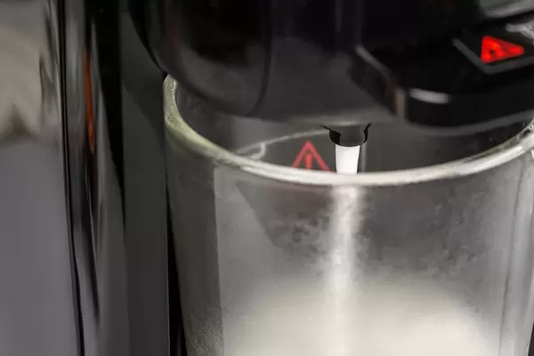 Close-up, process of making fresh latte coffee