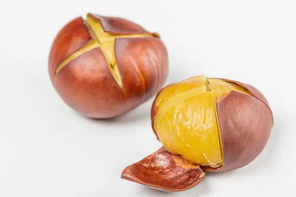 Close-up roasted chestnuts on white