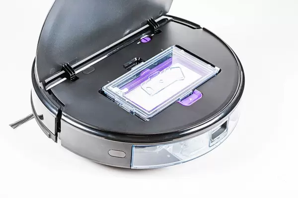 Close-up, robot vacuum cleaner with open top cover