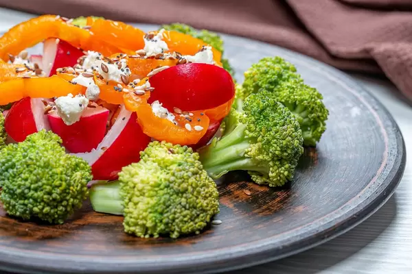 Close-up salad of broccoli, radish, bell pepper with seeds (Flip 2019)
