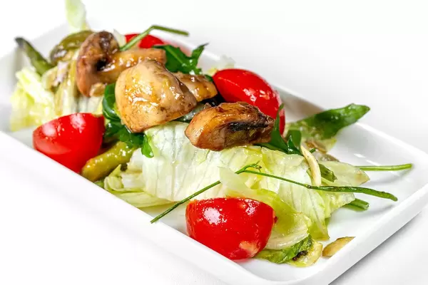 Close - up salad with fresh vegetables and pieces of mushrooms (Flip 2019)