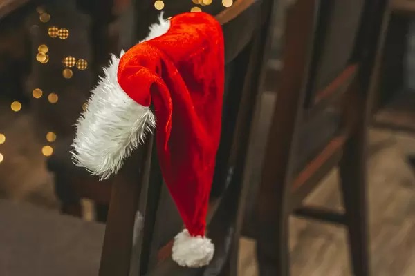 Close-up, santa claus hat on the back of a chair