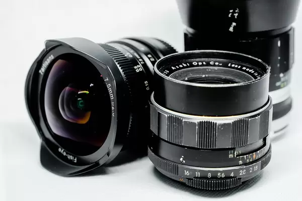 Close up shot of fisheye lens and 55mm lens