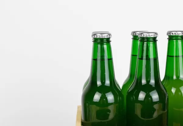 Close up shot of green glass bottles