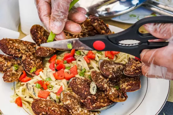Close up shot of person preparing a pasta dish (Flip 2019)