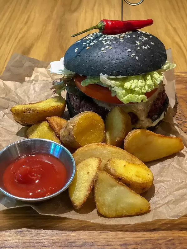 Close-up shot of Veg Kuro burger at Avocado Cafe