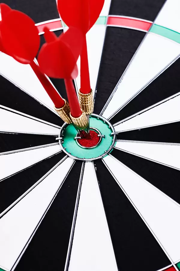 Close-up shot red darts arrows in the target center