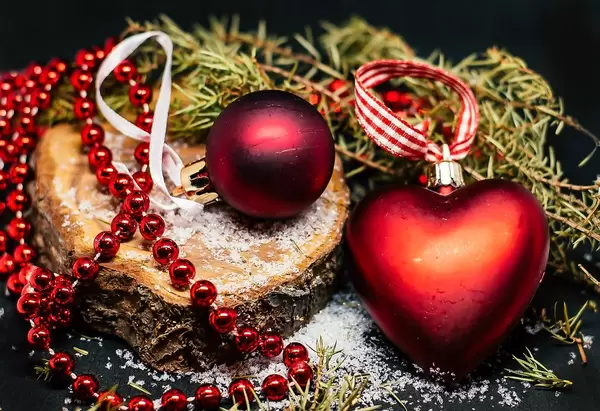 Close Up Still Life Photo of Red Christmas Ball and Heart as Decoration