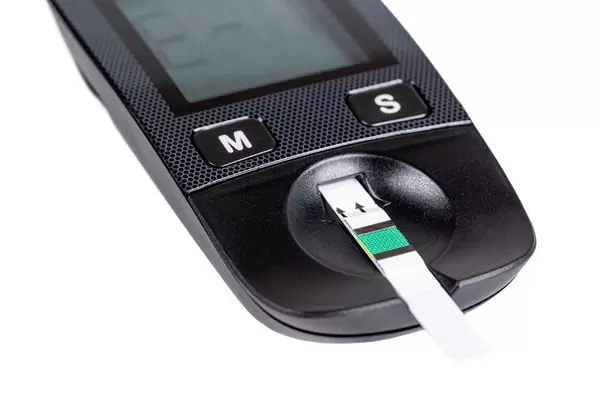 Close-up, test strip in a glucometer