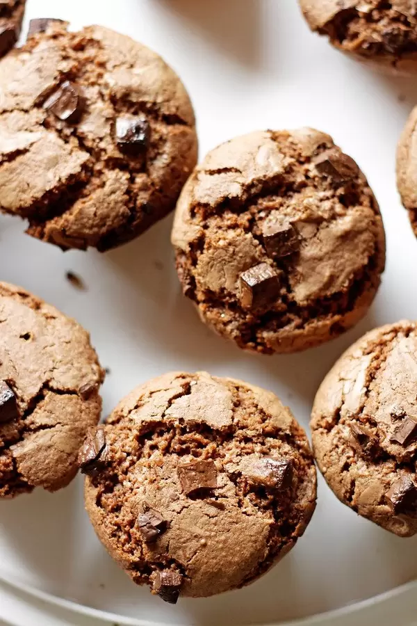 Close Up Top View Food Photo of Chocolate Chip Muffins on White Plate