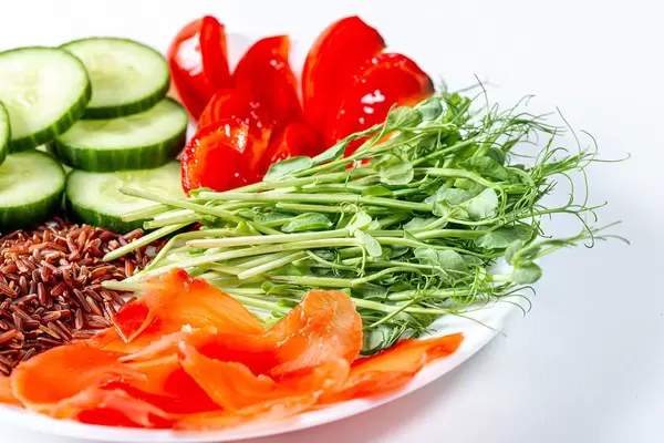 Close-up vegetarian meal with fresh vegetables, pea sprouts and pickled ginger (Flip 2019)