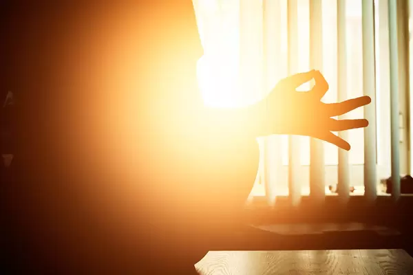 Close-up view of a yoga woman sitting in lotus asana
