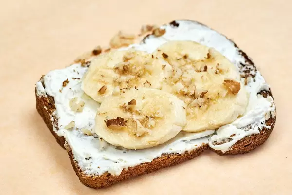 Close-up view of sliced banana with walnut