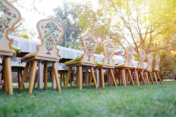 Close-up view of wooden chairs in the garden